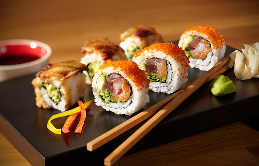 Concept of tasty food with sushi rolls, close up
