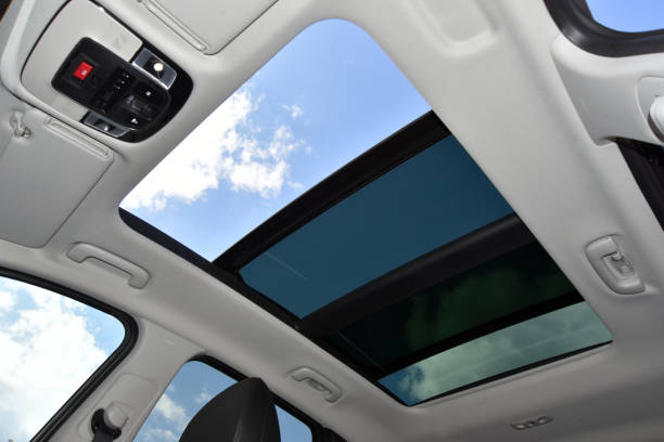 istock Panoramic sunroof in a passenger car 1358498195