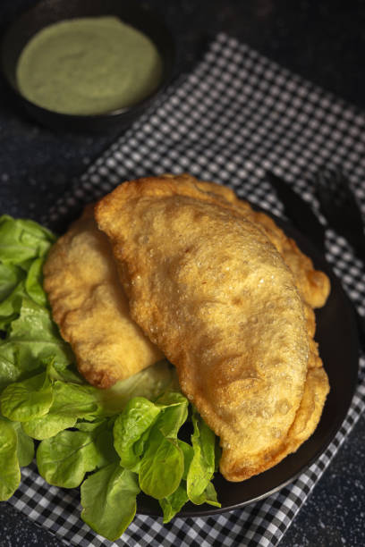 istock Homemade fried Neapolitan pizza with ham and cheese 1358500031