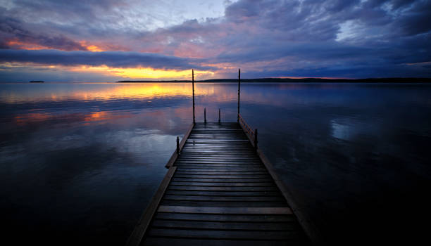 istock sunset on the jetty with stones in the foreground 1358500821