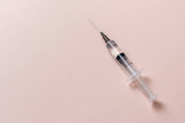 istock view from above simple medicine syringe, minimalistic style 1358508337