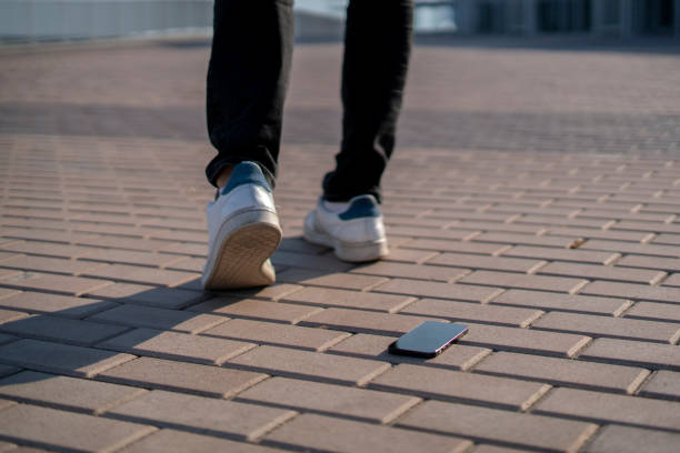 istock lost black smartphone outdoors laying on the ground 1358509333