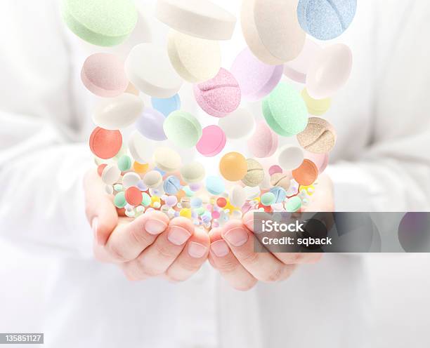 Colorful Pills Falling Into Open Palms Stock Photo - Download Image Now - Addiction, Adult, Antibiotic