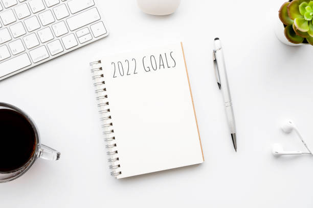 istock Notebook with 2022 goals text on it to apply new year resolutions and plan. 1358517059