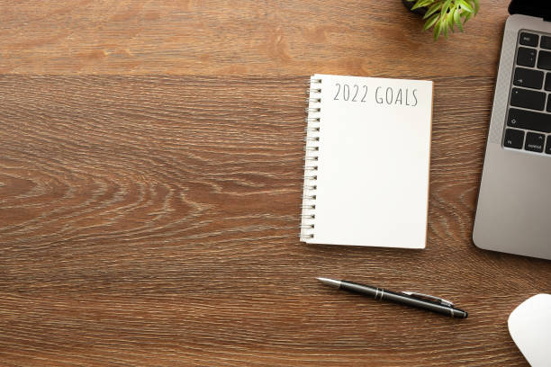 istock Notebook with 2022 goals text on it to apply new year resolutions and plan. 1358517113