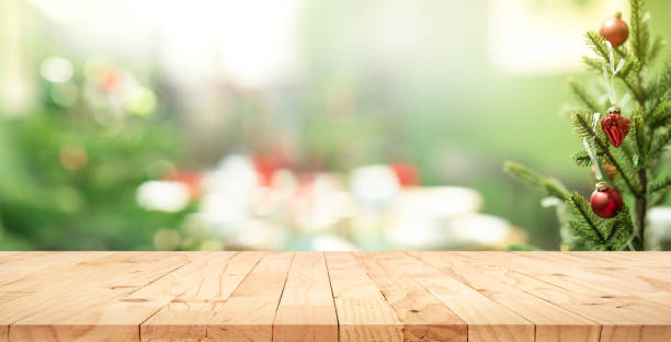 istock Selective focus.Empty wood table top with blur abstract light bokeh of christmas tree,decoration background 1358517831