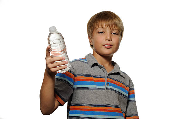 istock Boy Offering Bottle of Water 135852034