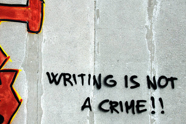 istock "Writing is not a crime" Wall graffiti protest 135852157
