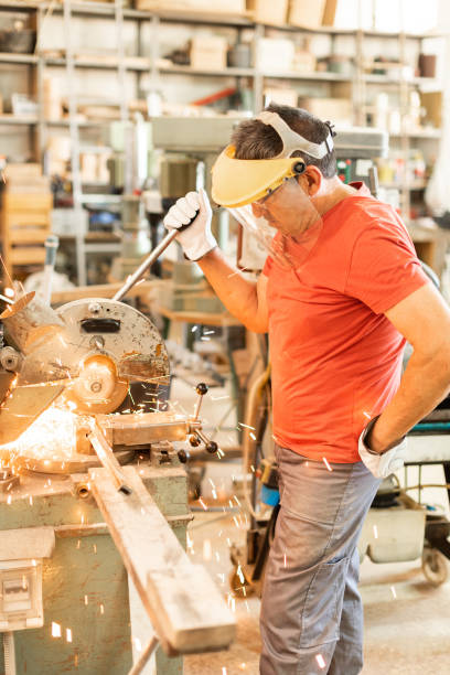 istock Adult man with a face shield and an iron cutter 1358525651