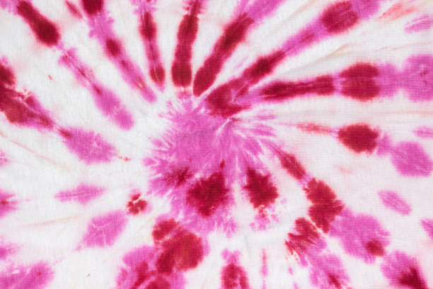 istock Red and white spiral pattern in tie dye style on the fabric made by hand. Flat lay. 1358525743
