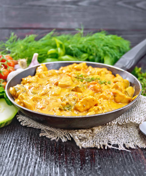 istock Goulash with tomato and zucchini in pan on dark board 1358532328