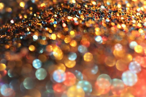 istock glitter texture. Shiny Festive Background.Christmas background. Glowing bokeh. Abstract background with bokeh and light.Shining bokeh background. soft focus. 1358533144