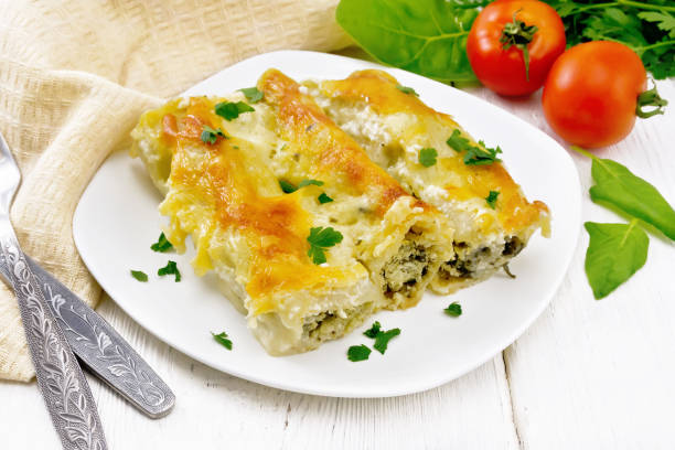 istock Cannelloni with curd and spinach in plate on light board 1358533247