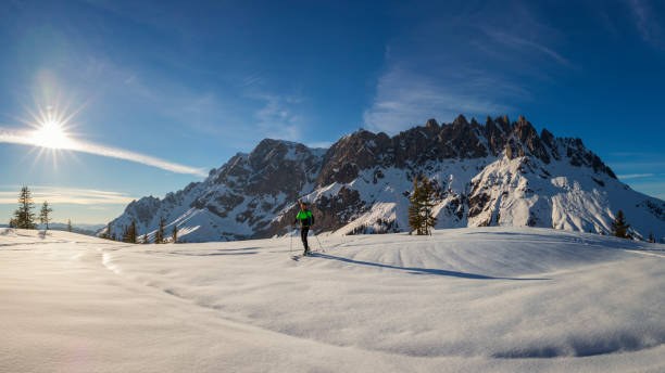 istock Ski mountaineer - Freerider at the way to Summit 1358535306