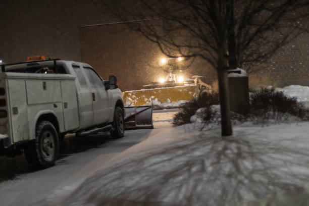 snowplows in night blizzard snow storm parking lot - snowplow snow parking lot pick up truck imagens e fotografias de stock