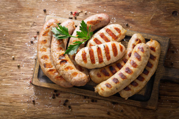 istock grilled sausages on a wooden board 1358536362