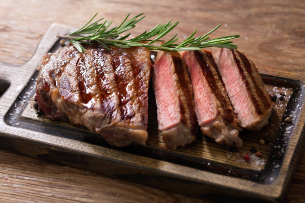 istock Sliced grilled meat steak with rosemary 1358536366