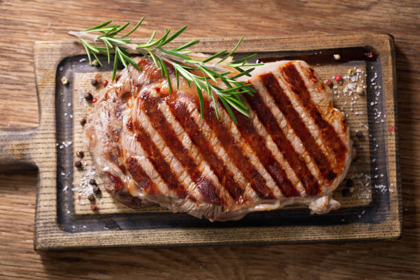 istock grilled meat with rosemary, top view 1358536367