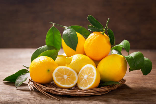 istock Fresh lemons  on a wooden background 1358536376
