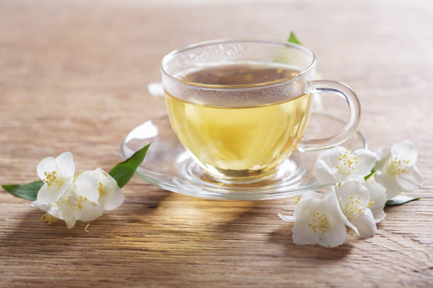 istock cup of jasmine tea and fresh jasmine flowers 1358536388