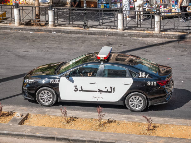 Jordanian police car on the streets. Amman, Jordan - 09.02.2021: Jordanian police car on the streets of Amman. amman pictures stock pictures, royalty-free photos & images