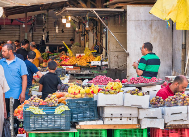 Fresh fruit market in Amman, Jorda. Amman, Jordan - 09.02.2021: Fresh fruit market in Amman, Jorda. Outdoor market with tropical fruits on display amman city stock pictures, royalty-free photos & images