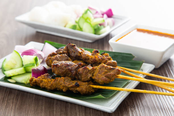 istock Malaysian beef satay with delicious peanut sauce. 1358542377
