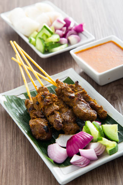 istock Malaysian beef satay with delicious peanut sauce. 1358542411