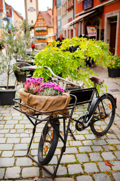 Germany, Rothenburg, fairy tale town, old streets, businesses, bicycles, flower baskets stock photo