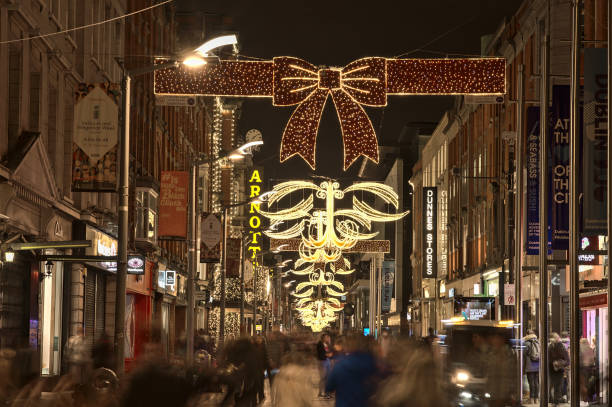 Festive Christmas lights and decorated Arnotts store on busy Henry Street during COVID-19 pandemic stock photo
