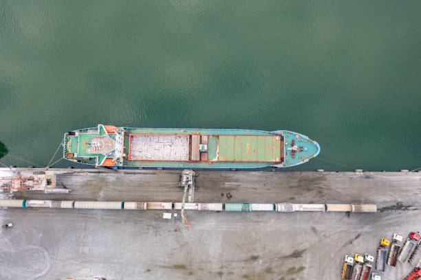 istock Aerial view of a large cargo ship and trucks ready for unloading grain. 1358546251