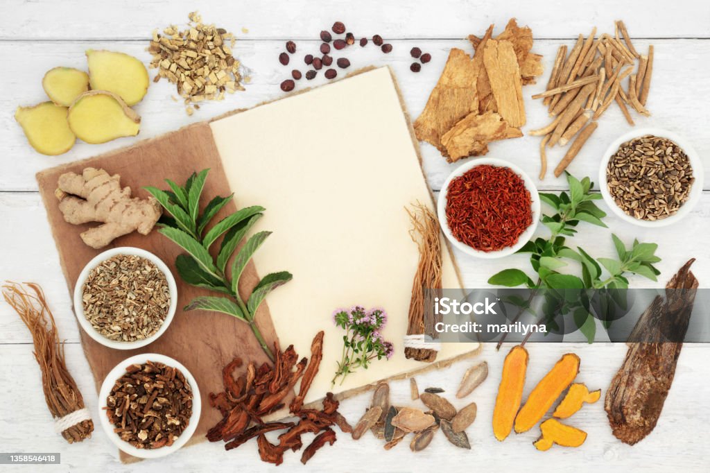 Herbal Medicine for Immune System Protection Herbal medicine preparation for immune system protection with fresh and dried herbs and spices with hemp notebook. Healthy food concept high in antioxidants, anthocyanins, vitamins and minerals.  "n Herbal Medicine Stock Photo