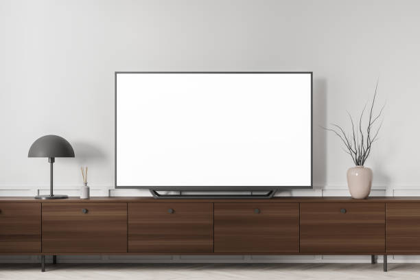 istock White living room interior with drawer and television mockup screen 1358548667