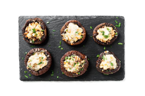 istock Baked mushroom caps stuffed with chicken meat 1358549199