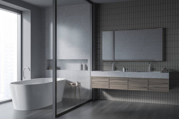 istock Bathroom interior with two sinks and mirror, bathtub behind partition, window 1358549269