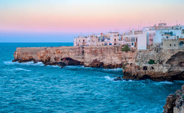istock Polignano a Mare cliff landscape, rocks and sea 1358550183