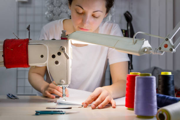 istock a sewing machine for which the dressmaker works in soft focus 1358551212