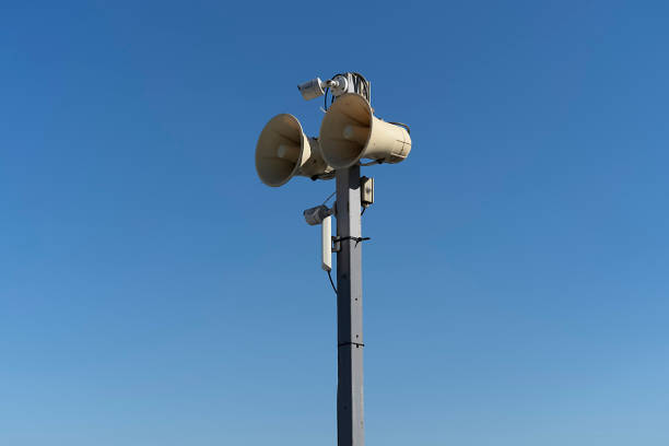 istock A pole with a loudspeaker on a blue sky background 1358552208