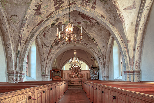 the interior of a swedish medieval church with gothic frescos, Bollerup, Sweden, September 15, 2021