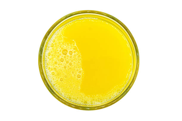 istock Orange juice isolated on white background top view 1358556286