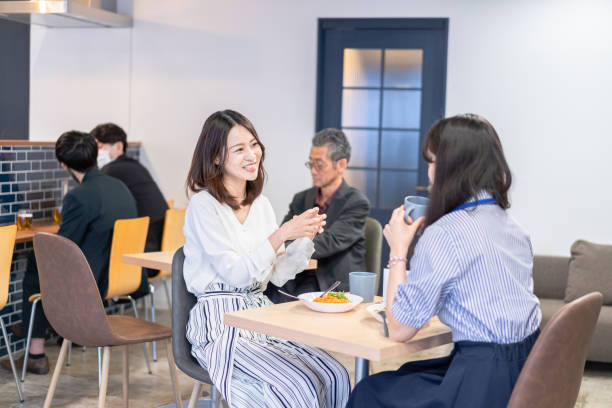 istock Office workers having lunch at a company cafeteria 1358558209