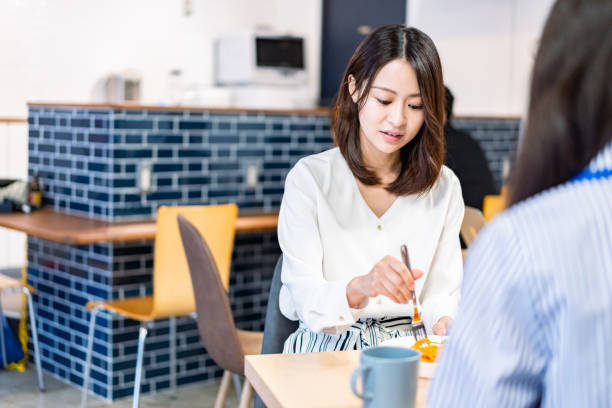 istock Office workers having lunch at a company cafeteria 1358558210