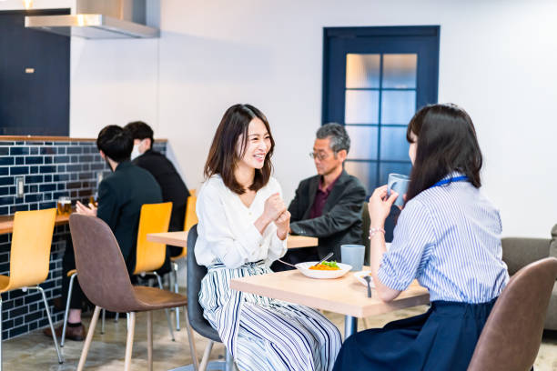istock Office workers having lunch at a company cafeteria 1358558211