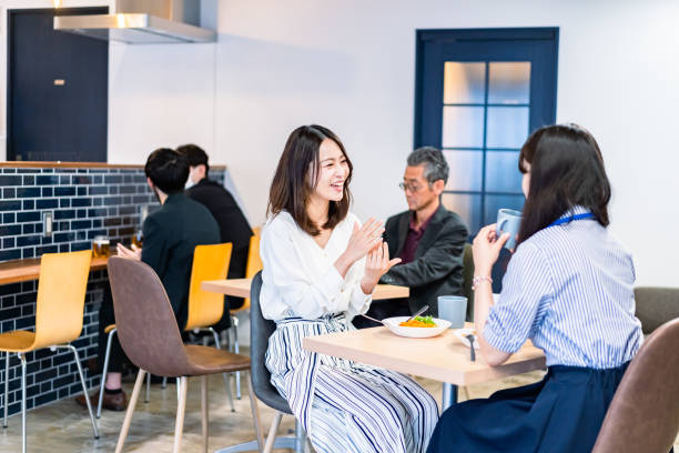istock Office workers having lunch at a company cafeteria 1358558212