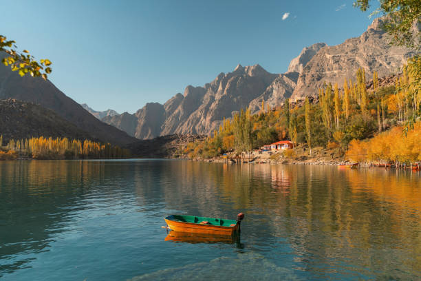 istock Boat on lake in Himalayas mountains  in autumn 1358559498