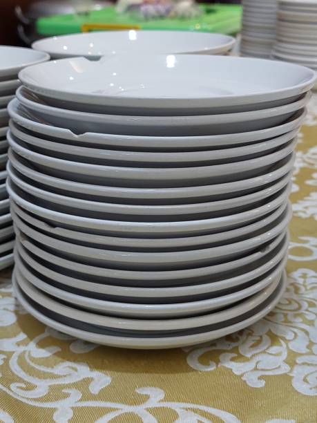 istock Close-Up Of Stack Of White Plates 1358561405