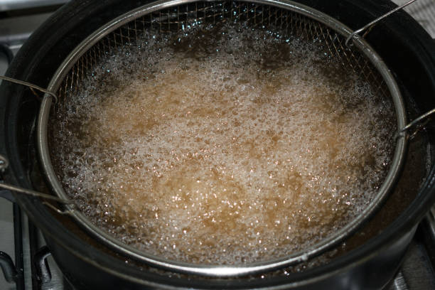 istock fryer filled with boiling oil 1358561598