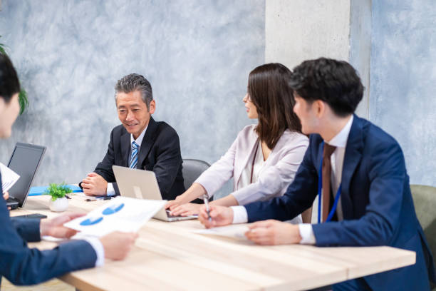 istock Businesspeople having a discussion in the office 1358562663