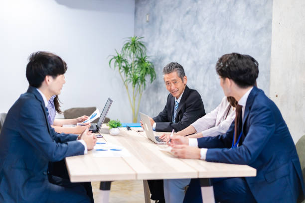 istock Businesspeople having a discussion in the office 1358562668