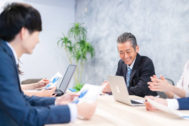 istock Businesspeople having a discussion in the office 1358562670